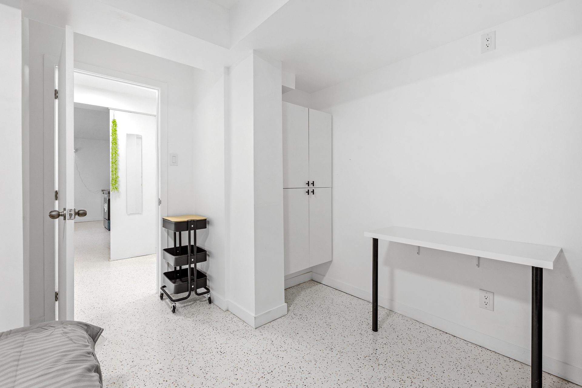 Unit 06 bedroom workspace wall with wardrobe storage