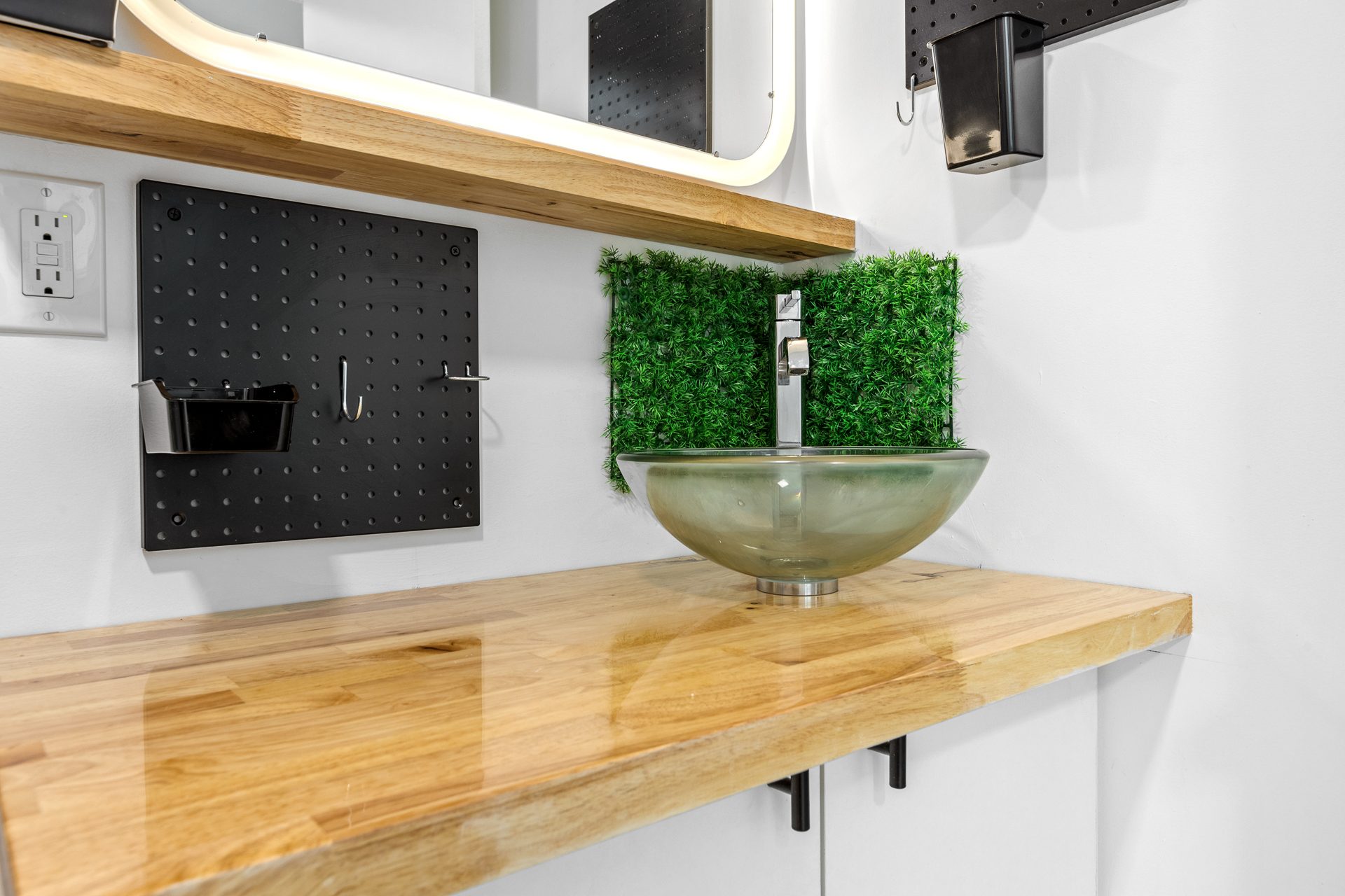 Unit 06 bathroom vanity with glass sink and mirror